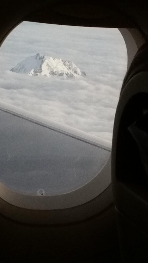 Mountain breaking through the clouds